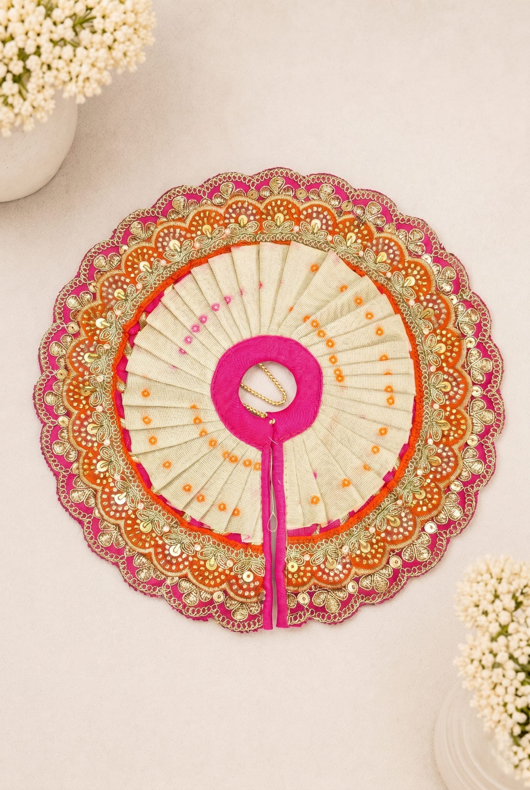 Premium handcrafted Kesar Pushpa Set Laddu Gopal dress in ivory, orange and pink tones with artisan embellishments and festive devotional design